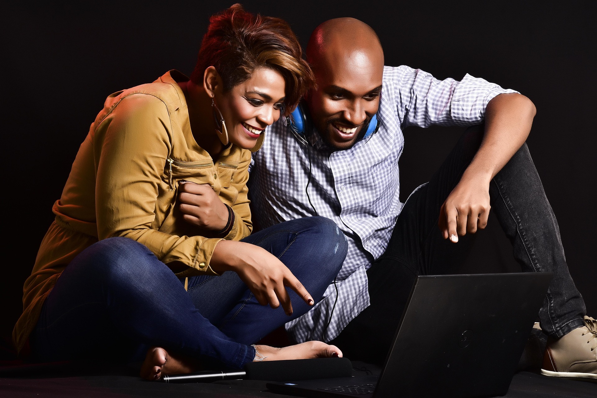 Two people looking at a computer