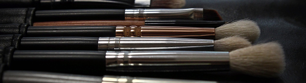 Close-up of black and brown makeup brushes. 
