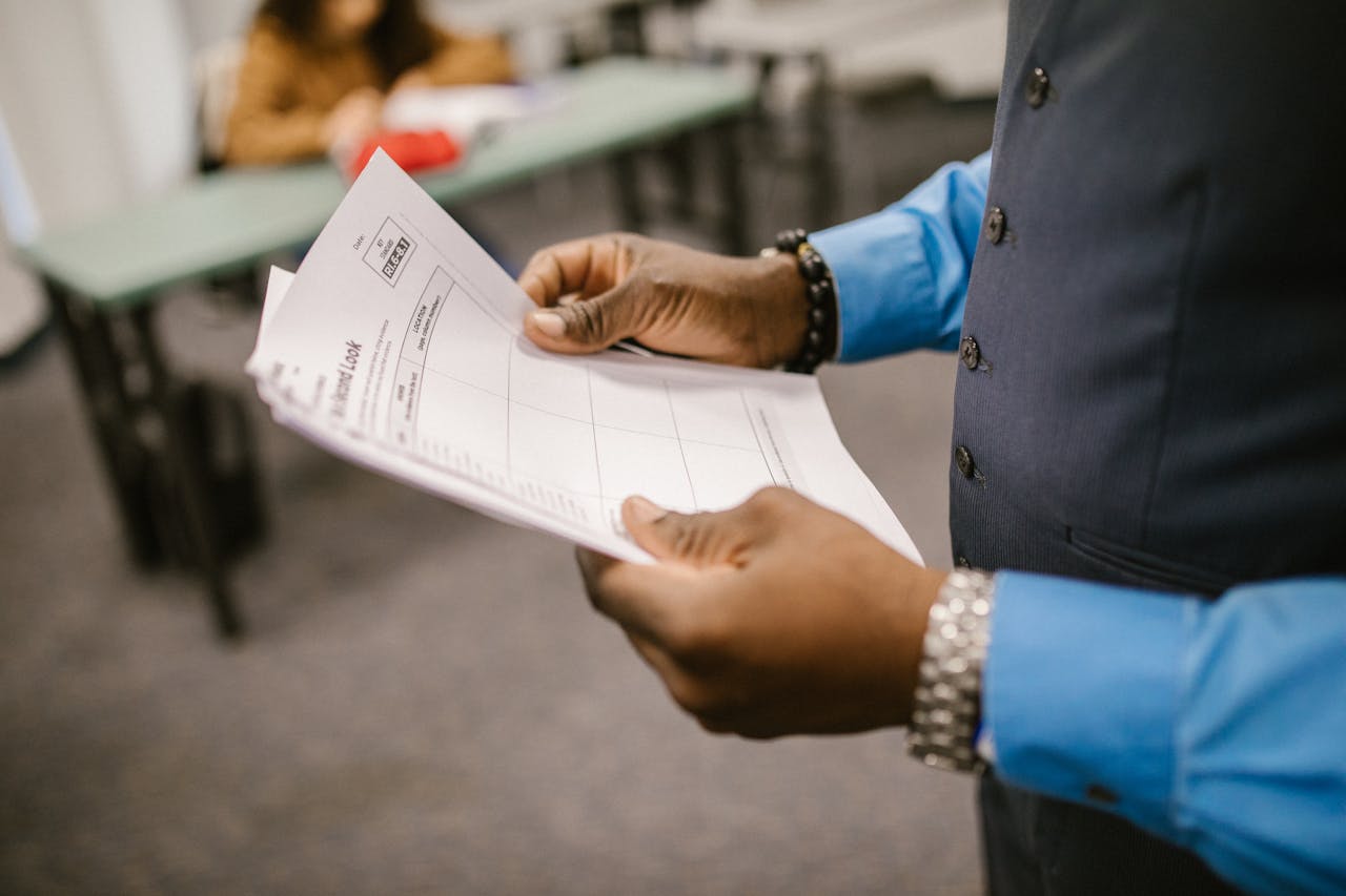 Photo of a man looking at a piece of paper