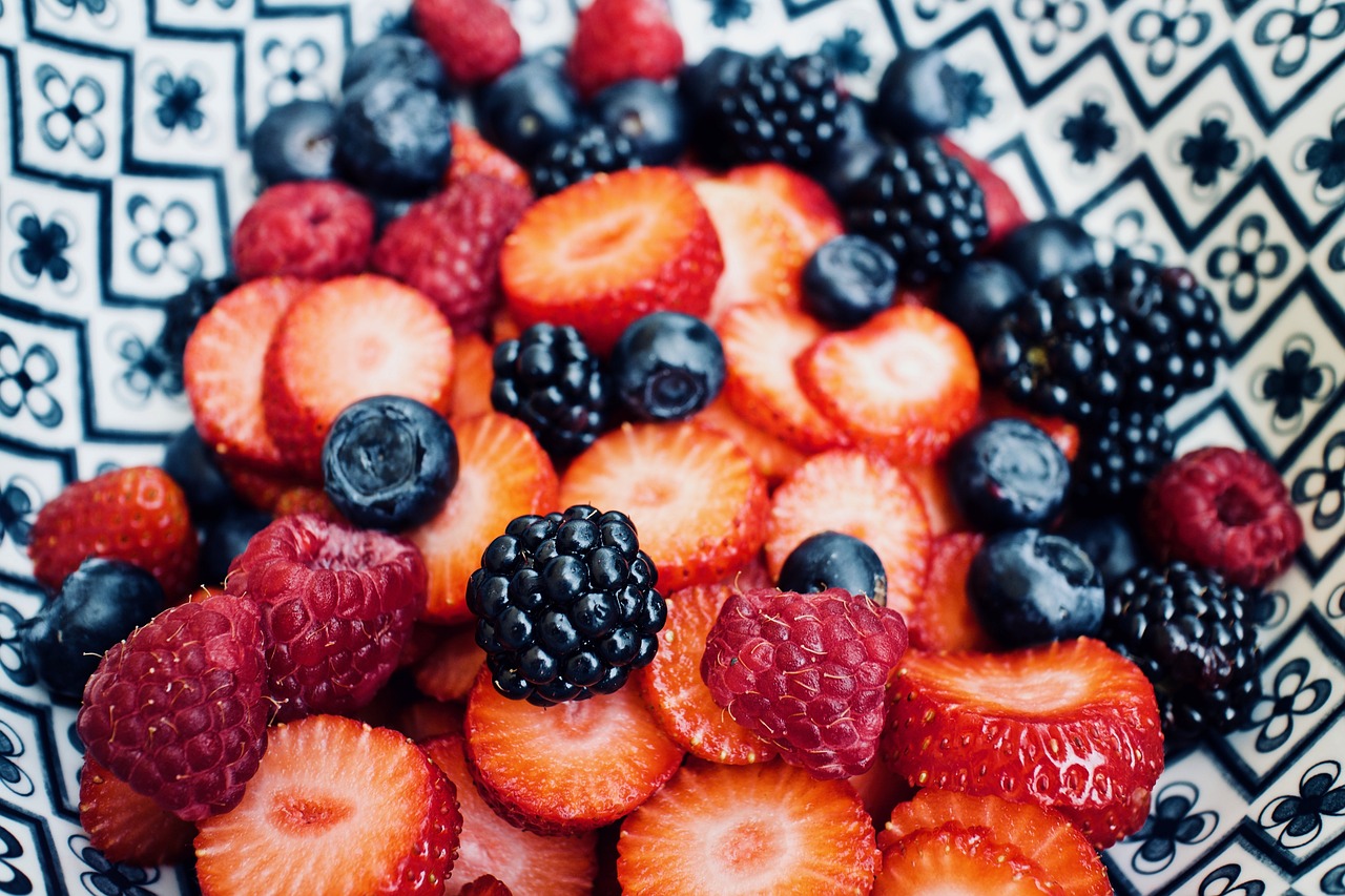 summer berries piled on a plate 